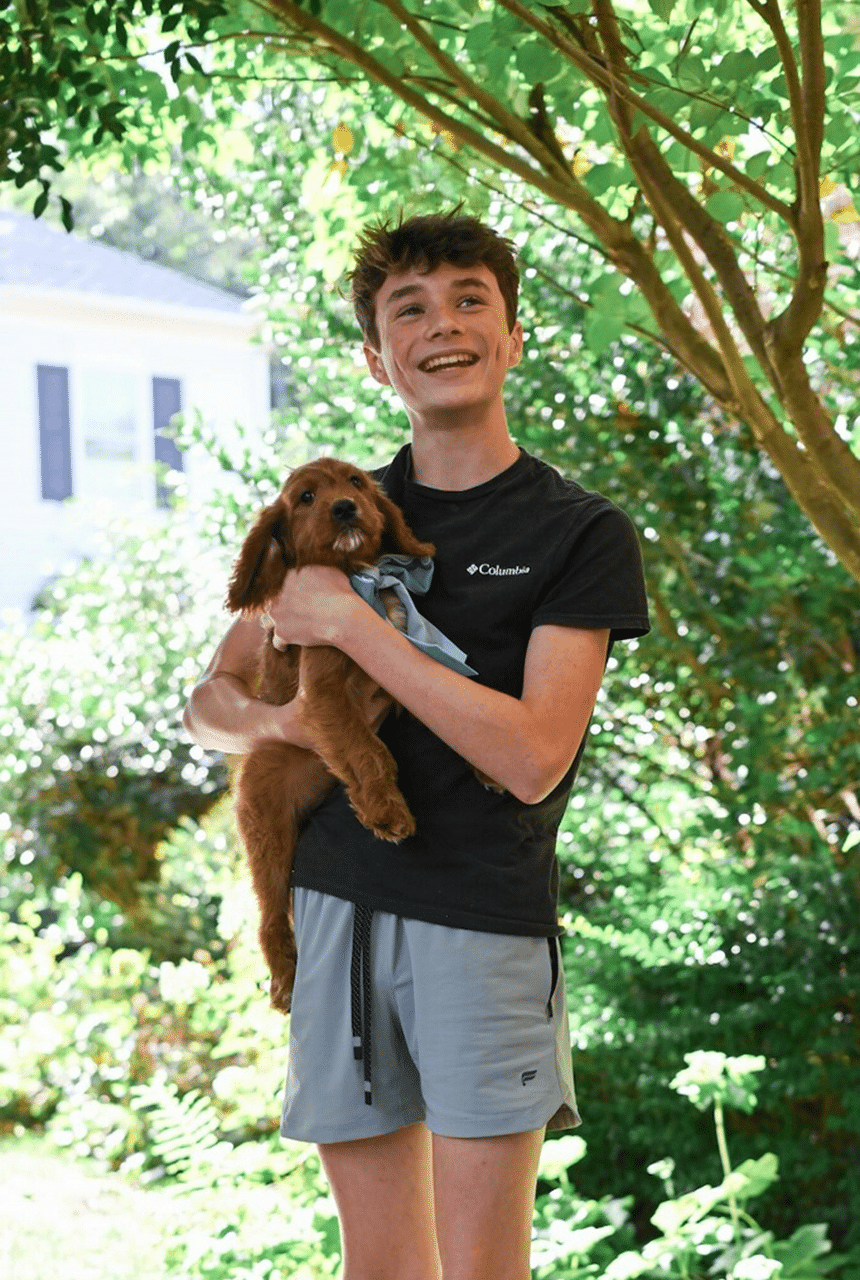 Mini Golden Retriever Pup with owner